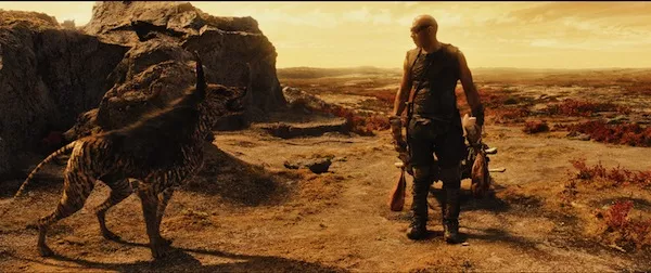 A BOY AND HIS DOG: Our hero (Vin Diesel) makes a friend in Riddick. (Photo: Universal)