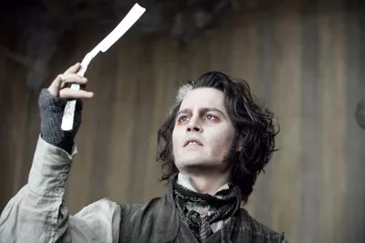 BLADE RUNNER: Sweeney Todd (Johnny Depp) lets his fingers do the stalking in Sweeney Todd: The Demon Barber of Fleet Street. - LEAH GALLO / DREAMWORKS &amp; WARNER BROS.