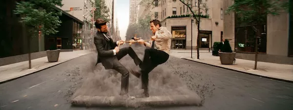 DAYDREAM BELIEVER: Walter (Ben Stiller, right) imagines that he and his boss (Adam Scott) are fighting over a Stretch Armstrong doll in The Secret Life of Walter Mitty. (Photo: Fox)