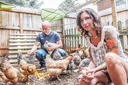 JUSTIN DRISCOLL - Kendall Kendrick and Dave Conlin with their flock of chickens