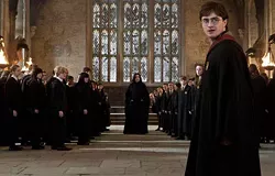 WARNER BROS. - MAGIC: THE GATHERING: Severus Snape (Alan Rickman, center background) and Harry (Daniel Radcliffe, front right) settle their affairs in Harry Potter and the Deathly Hallows &mdash; Part 2.