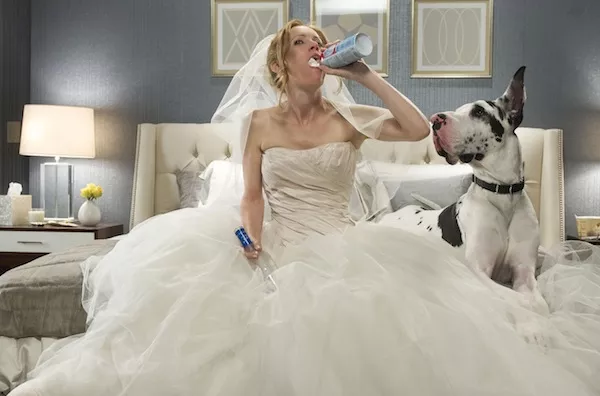 MANN OVERBOARD: Kate (Leslie Mann) whips herself up into a feeding (and drinking) frenzy in The Other Woman. (Photos: Barry Wetcher / Fox)