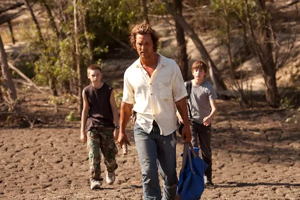 MUD IS THICKER THAN WATER: Neckbone (Jacob Lofland), Mud (Matthew McConaughey) and Ellis (Tye Sheridan) search for ways to get a land-bound boat to the river in Mud. (Photo: Roadside Attractions)