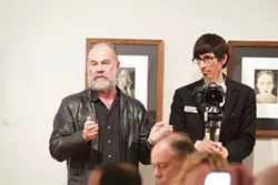 MERT JONES - Phil Moody, photography professor at Winthrop University, standing with Mitchell Kearney at an October meeting of the members of The Light Factory