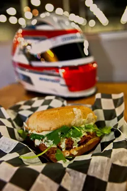 PHOTOS BY JEFF HAHNE - Pit Road Bar &amp; Grill chef Donnie Simmons fires up a Concord sandwich.