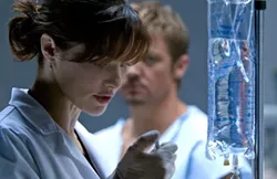 UNIVERSAL - Rachel Weisz and Jeremy Renner in The Bourne Legacy