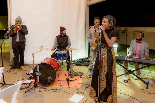 Buckley (second from left) behind the kit with Hip Hop Orchestrated.