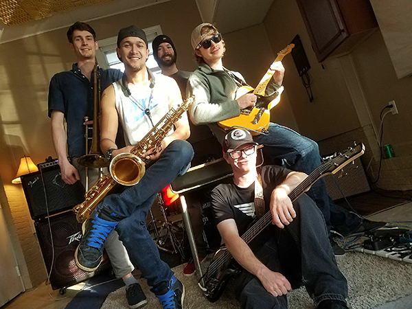 AKITA is ready to funk you up: Dan Hamalainen (from left), Charlie Lampercht, Patrick Buckley, Sam Farnham and Zak Ferrell (seated). (Photo by Jamar Perry)