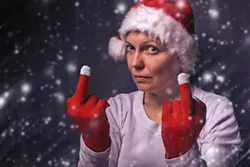 beautiful-woman-in-santa-claus-costume-giving-middle-finger-.webp