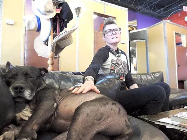 Hope Nicholls with one her pups, Phoebe, at her Plaza Midwood boutique, Boris & Natasha.
