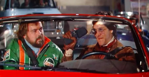 Tim McIntire and Raul Julia in The Gumball Rally (Photo: Warner)