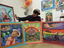 Rosalia Torres-Weiner in her studio with some of the “Magic Kite” panels. (Photo by Ryan Pitkin)
